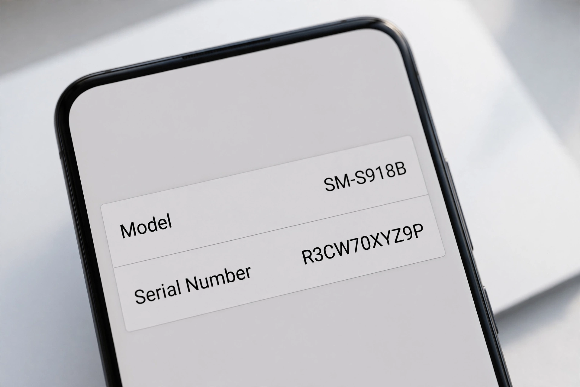 Smartphone about-phone screen showing model and serial number information