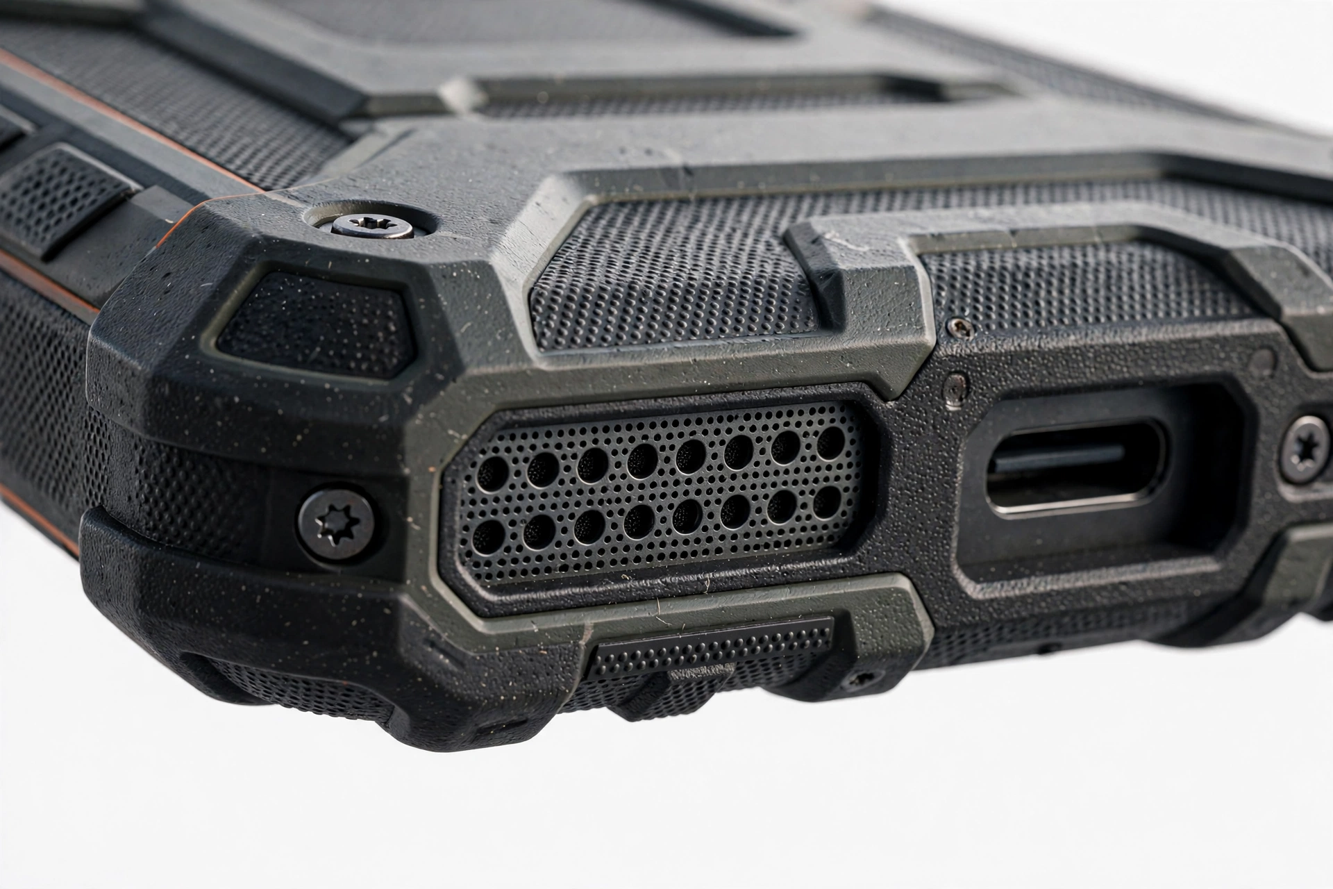 Close-up of a rugged smartphone speaker grille