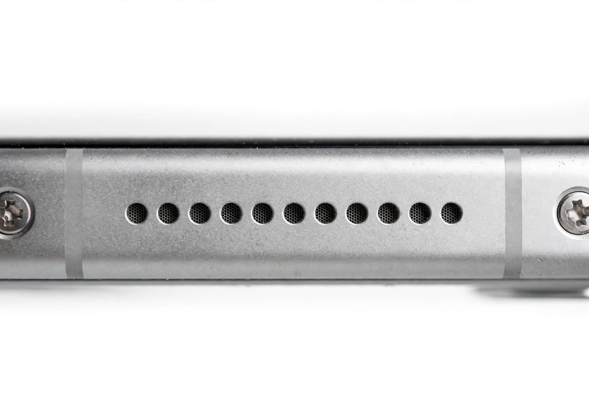 Close-up of smartphone bottom edge speaker grille