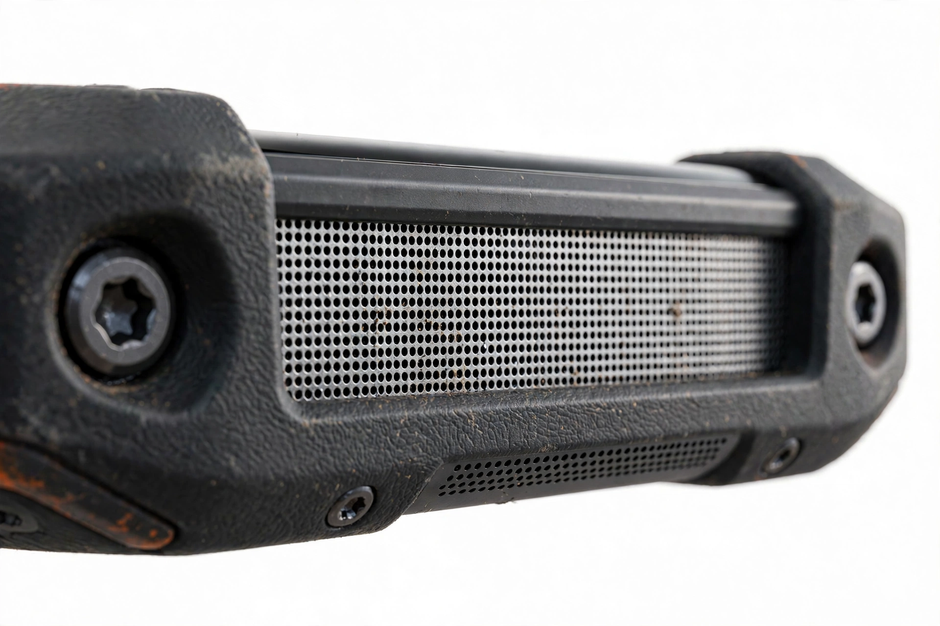 Close-up of a rugged smartphone bottom edge speaker grille