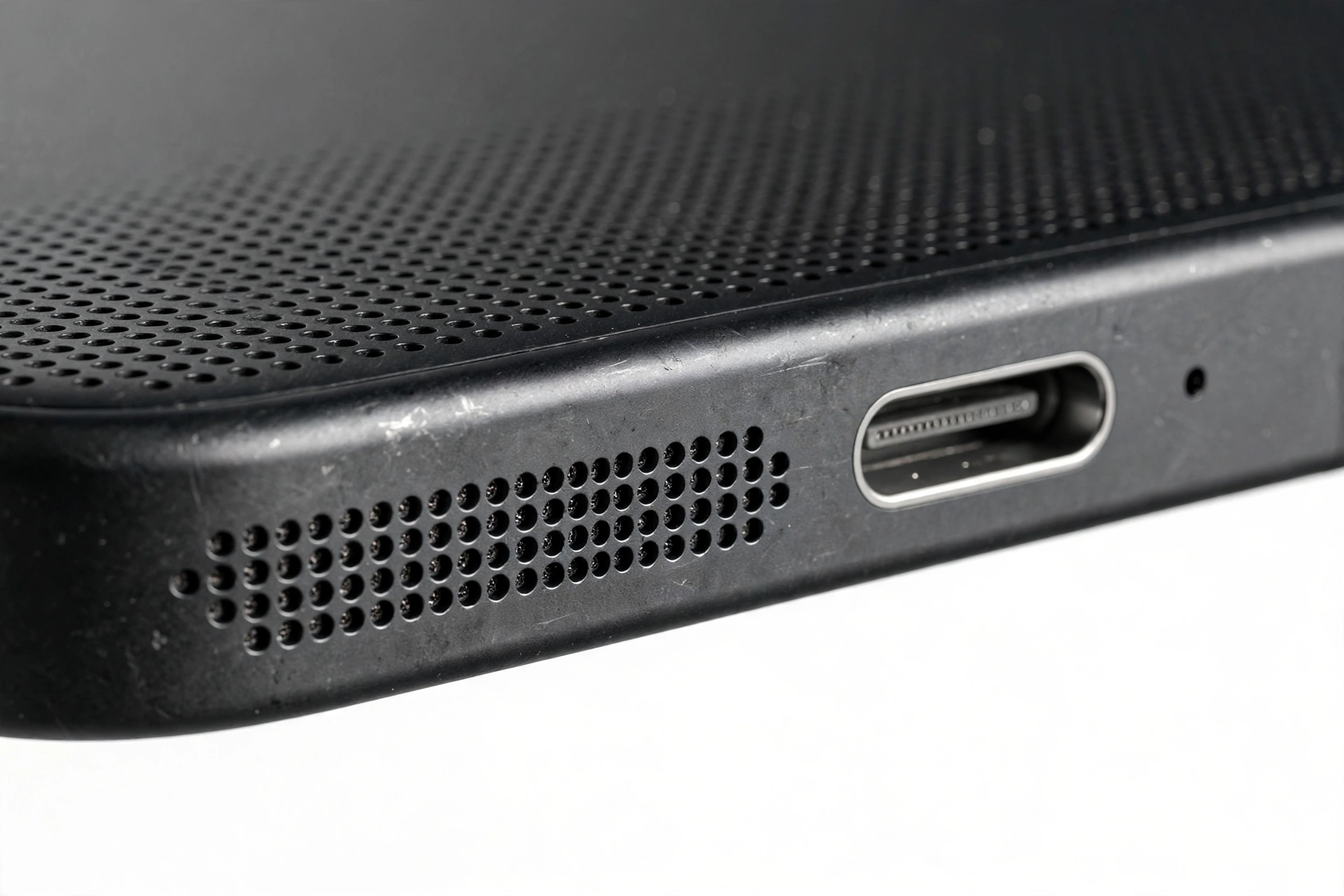 Macro close-up of smartphone speaker grille