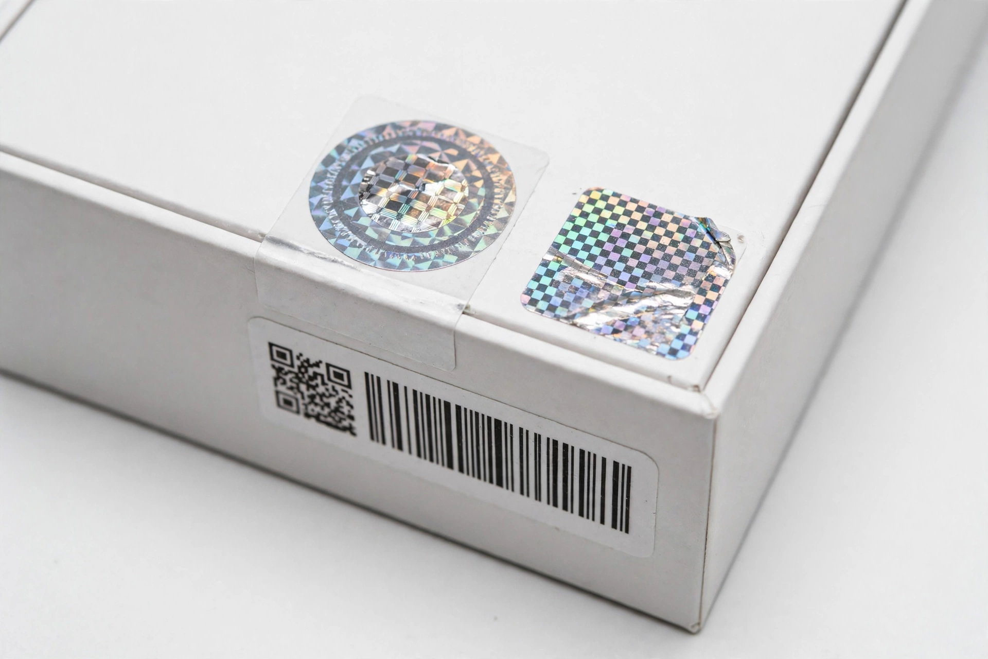 Smartphone box with verification labels and serial number barcode